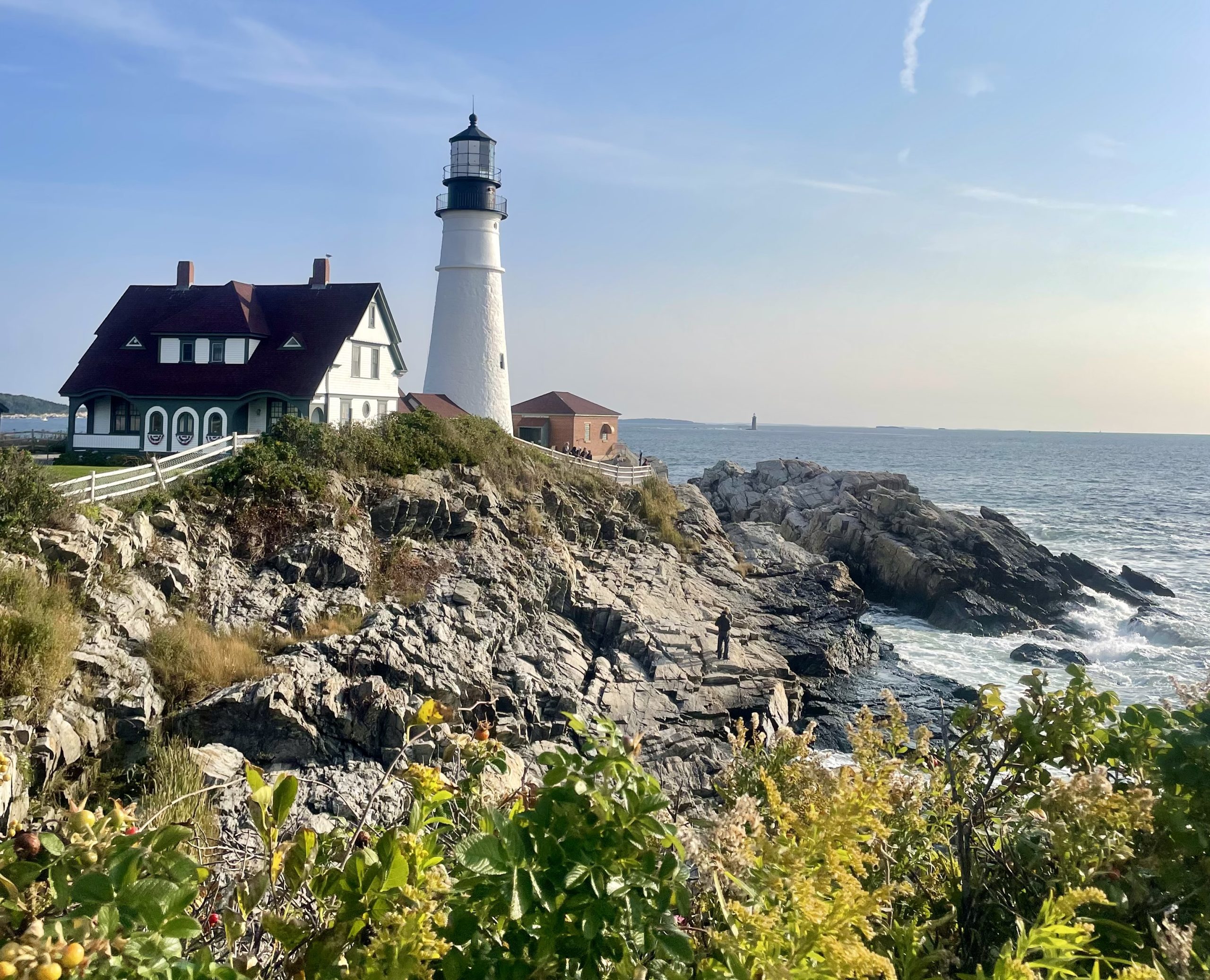 A stately lighthouse looking out over the sea.